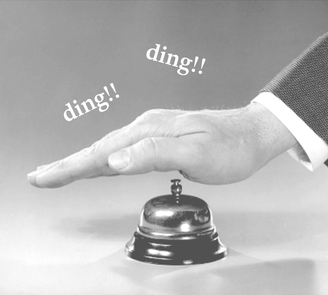 Hand pressing a service bell symbolizing client success and creative excellence